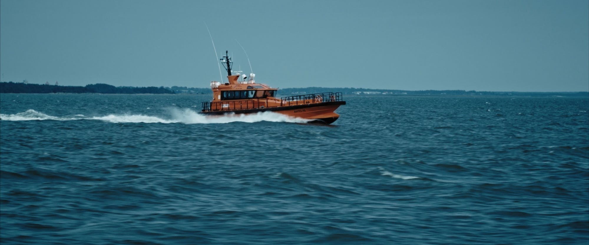 a boat going at high speed on a sea